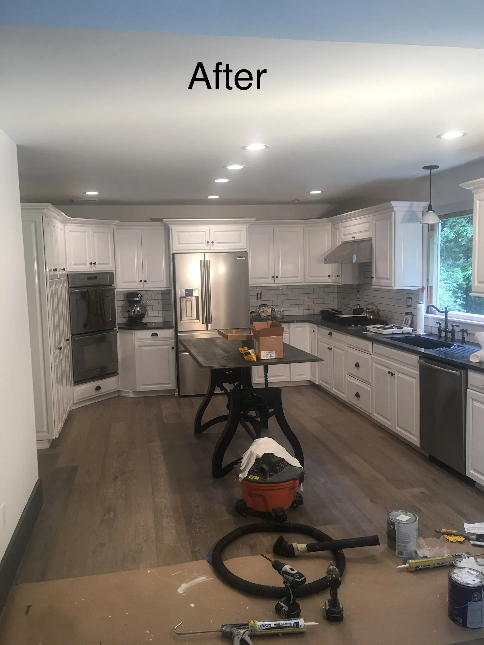 Updated kitchen after remodeling with modern cabinets and a new design.