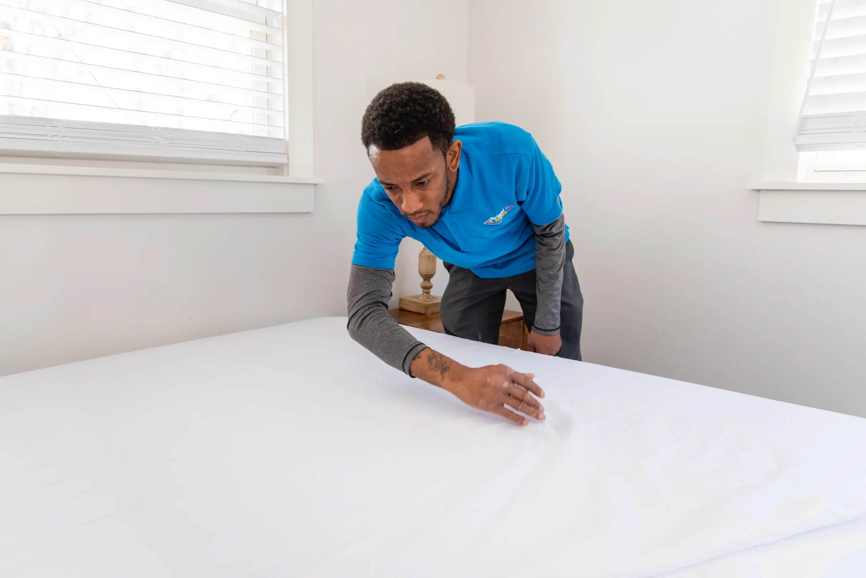 A sparkling clean Airbnb bedroom with neatly arranged linens and fresh decor in Royal Oak.