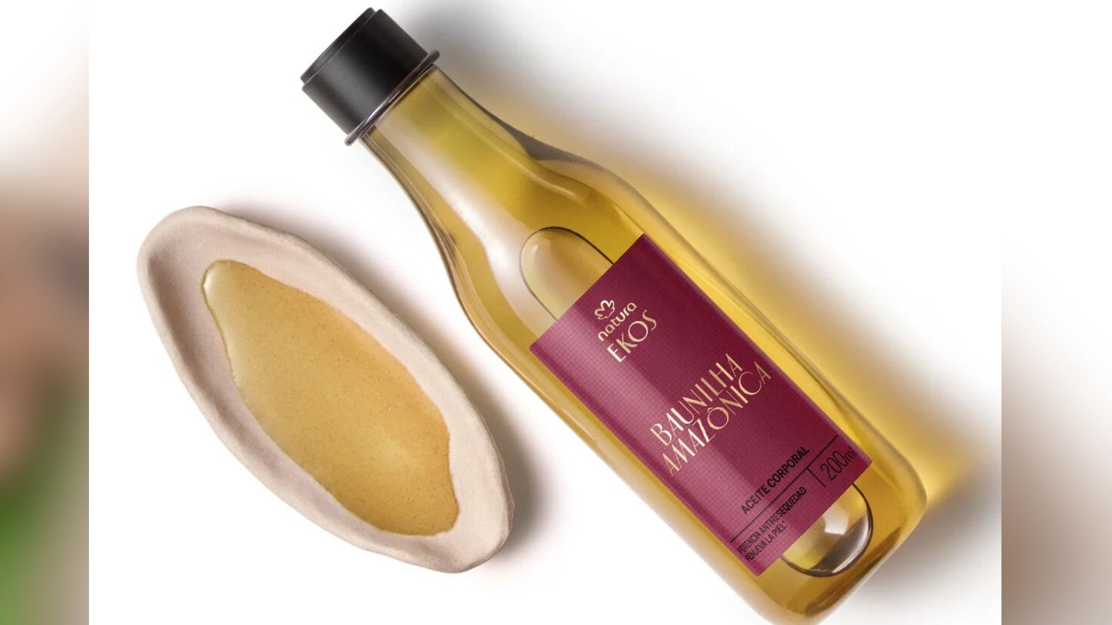 Frasco de &oacute;leo corporal Natura Ekos Baunilha Amaz&ocirc;nica 200ml e amostra do produto em recipiente
