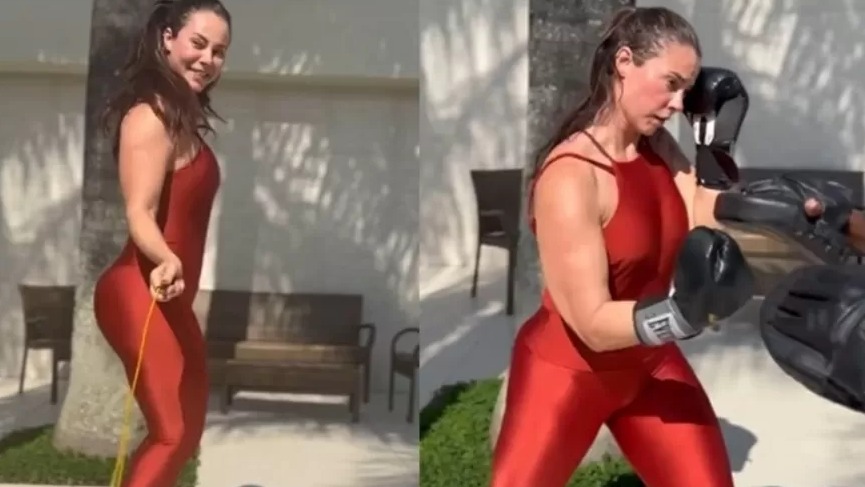 Paolla Oliveira pulando corda e praticando boxe com luvas, em look fitness vermelho.