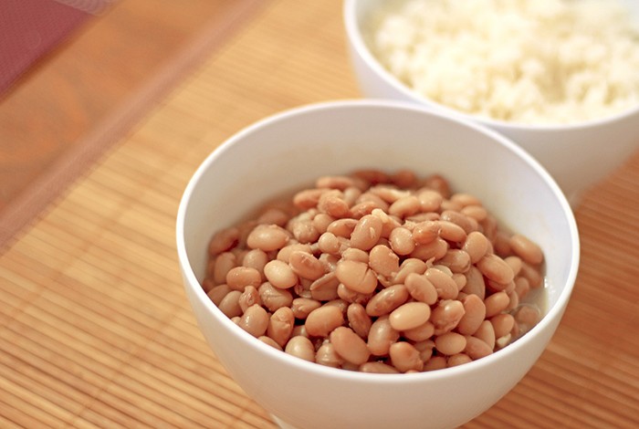 White bowls filled with beans and rice.