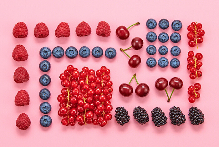 Different types of berries lined up.