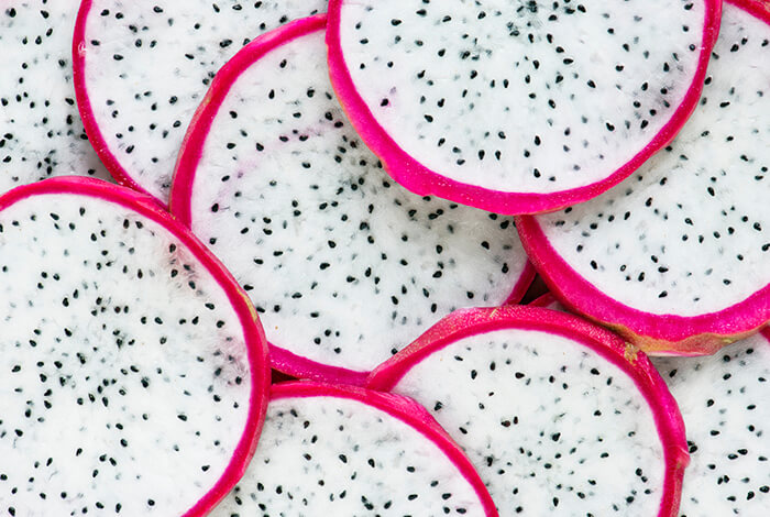 Dragonfruit slices that are cut crosswise.