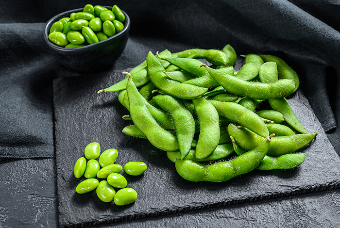 Piles of edamame beans.
