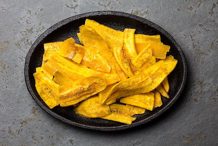 A plate full of plantain chips.
