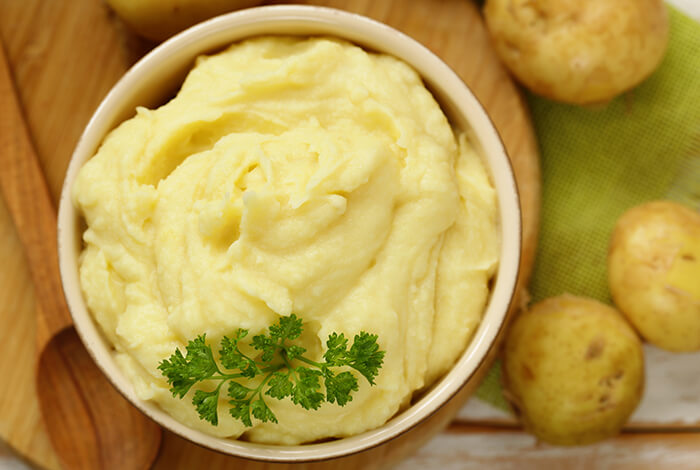 A bowl filled with mashed potatoes.