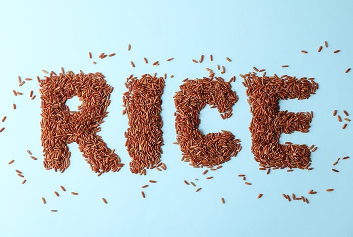 The spelling of RICE using uncooked red rice.