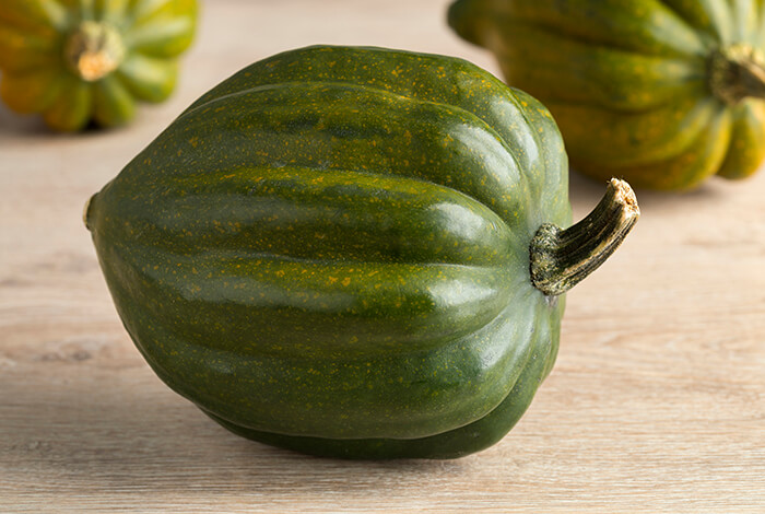 An unripe acorn squash.