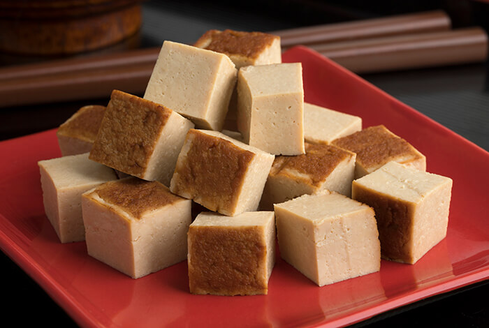 Cooked tofu cubes for dogs.