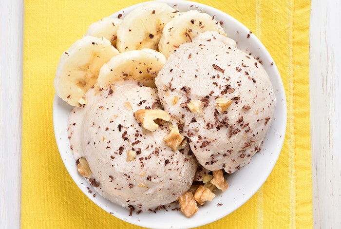 Dog ice cream with peanut butter, banana slices, and nuts.