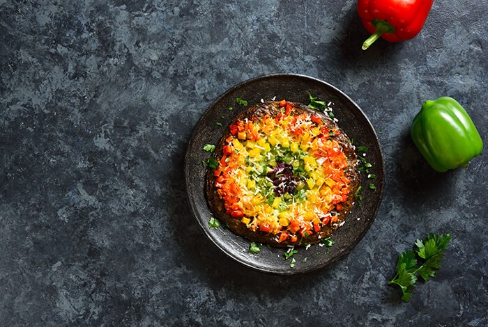 Chopped bell peppers fill up a saucer.