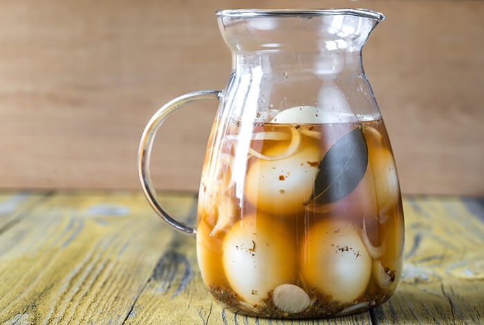 Fermented eggs placed inside a glass pitcher. 