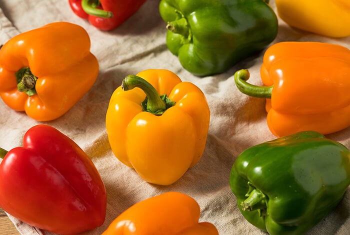 Different types of shiny bell peppers.