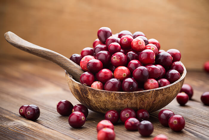 A bowl full of fresh cranberries.