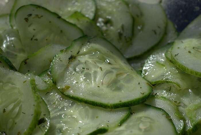 A close-up look at cooked sliced cucumbers.