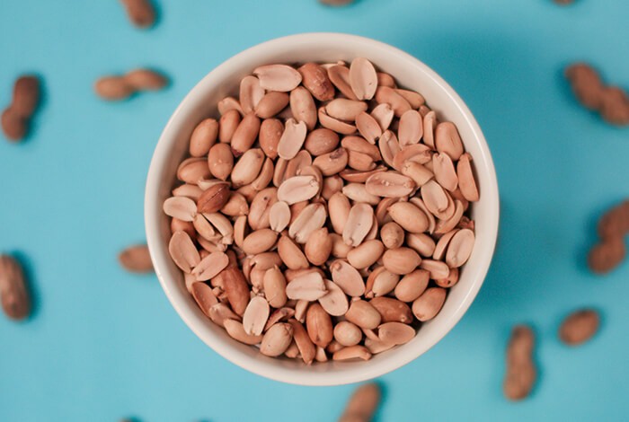 A bowl of toasted peanuts.