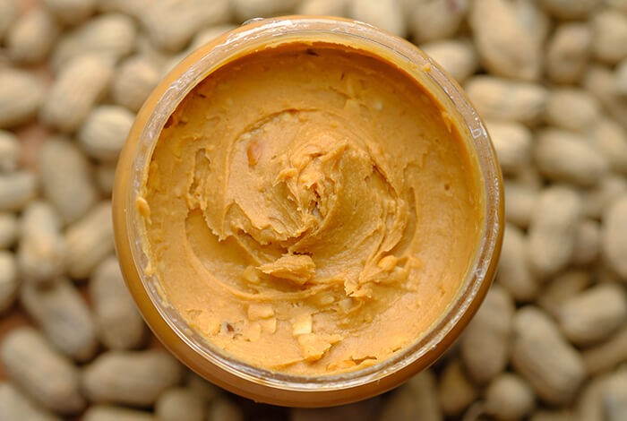 A jar filled with peanut butter.