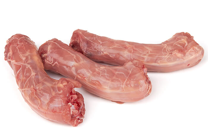 Three pieces of raw turkey necks.