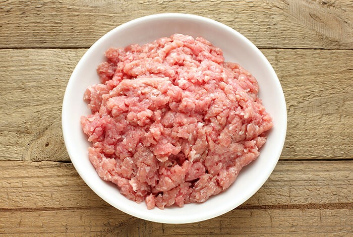 Ground turkey on a white ceramic plate.