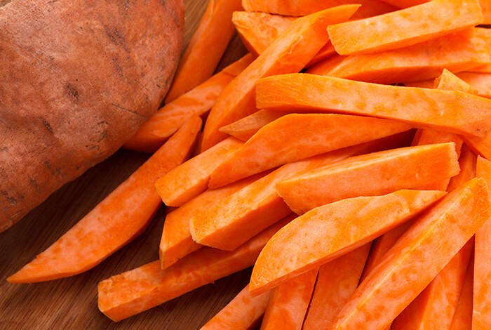 Closeup of raw straight-cut sweet potatoes.