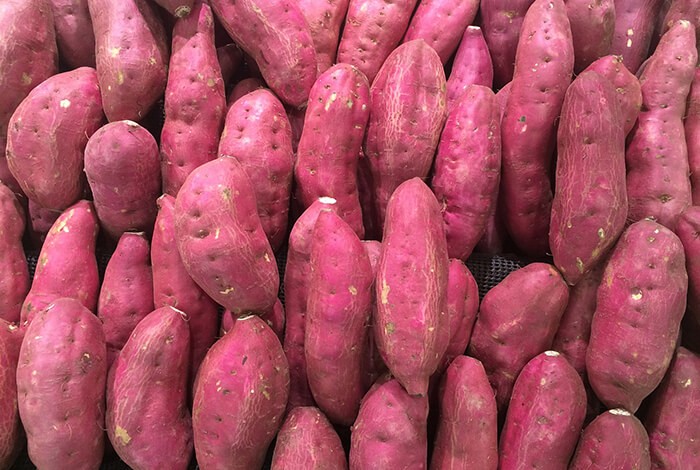 Raw purple sweet potatoes.