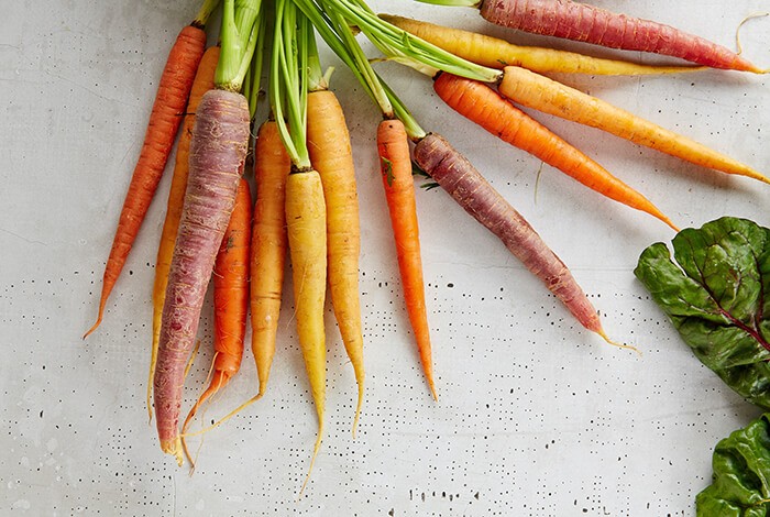 Raw carrots in different colors.