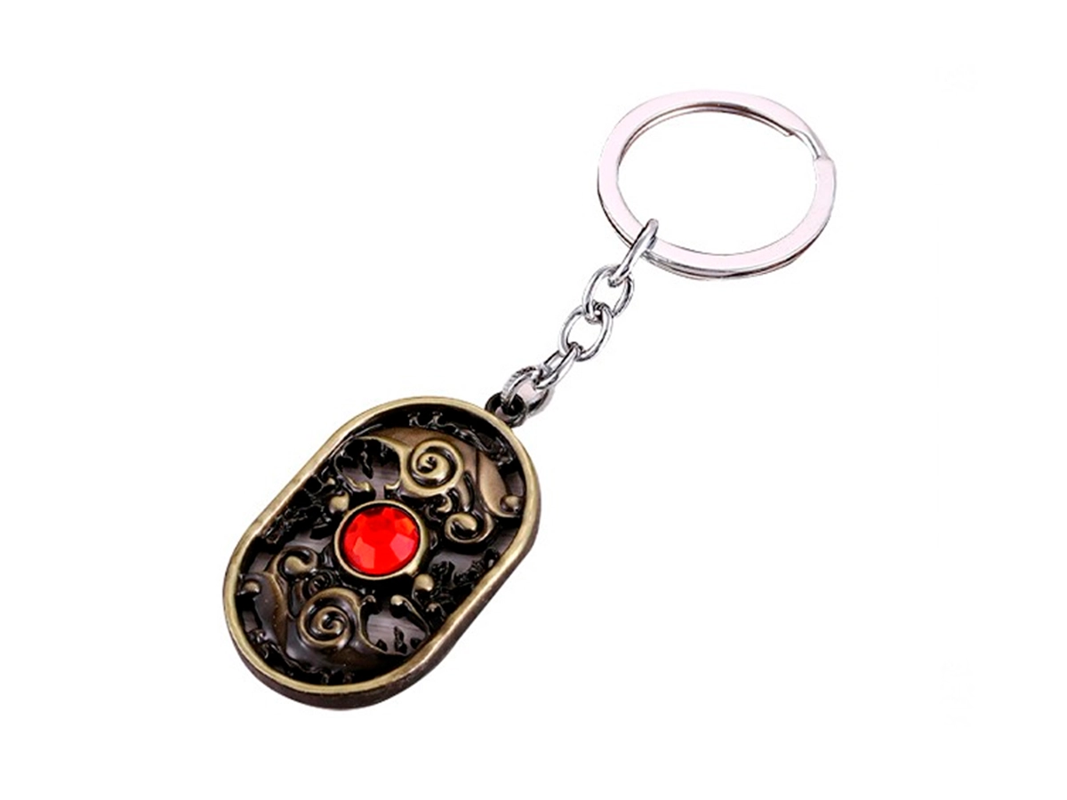 LLAVERO DOTA SPIRIT RED, COLOR BRONZE, FORMA OVALADA CON 1 ESFERA ROJO INCRUSTADA 2 MOD ( SPIRIT RED ) vista 2