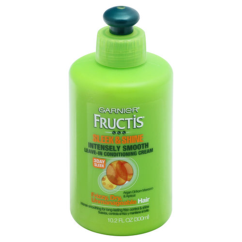 Intensely smooth. Frizzy, dry, unmanageable hair. Argan oil from Morocco & apricot. Intense smoothing for long-lasting frizz control & shine. 3 day sleek. Want a smooth look and frizz-control that lasts? Get our ultimate sleek. Fructis Sleek & Shine. Intensely Smooth Leave-In Conditioning Cream: The formula with argan oil from Morocco and apricot soaks deeps into frizzy, dry hair to smooth each strand. Proven to Perform: Get 10x smoother (In a frizz test when using Garnier Fructis Sleek & Shine System of Shampoo, Conditioner and Leave-In Conditioner vs. a non-conditioning shampoo); Stay sleek for 3 days (In a frizz test when using Garnier Fructis Sleek & Shine System of Shampoo, Conditioner and Leave-In Conditioner vs. a non-conditioning shampoo); Even in 97% humidity (In a frizz test when using Garnier Fructis Sleek & Shine System of Shampoo, Conditioner and Leave-In Conditioner vs. a non-conditioning shampoo). For hair that shines with all its strength. Create and control any style you want with Garnier Fructis Style. www.garnier.com. Made in USA.