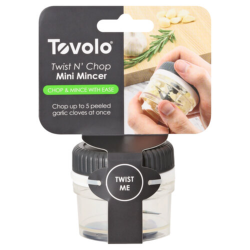 Chop & mince with ease. Chop up to 5 peeled garlic cloves at once. Twist me. Make perfectly chopped or minced garlic in seconds. Built-in gears rotate the sharp center blades with simple twist of the lid. Blade column disassembles for easy cleaning. Garlic comb included for sweeping out mincer. Dishwasher safe. Food safe. www.tovolo.com. BPA free. Made in China.