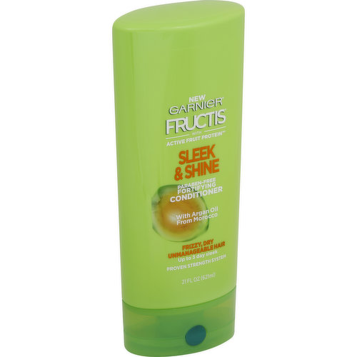 With a Argan oil from Morocco. New. Fructis with active fruit protein. Frizzy, dry unmanageable hair. Up to 3 day sleek. Proven strength system. Hair is almost entirely made up of protein, which gives hair its strength. All new, paraben-free Fructis formula with Active Fruit Protein, an exclusive combination of citrus protein, Vitamins B3 & B6, fruit & plant-derived extracts and strengthening conditioners, are designed for healthier, stronger hair. With shampoo, conditioner & leave-in cream. Sleek & Shine with fairly & sustainably sourced Argan Oil from Morocco soaks into frizzy, dry hair to smooth each strand. Long lasting frizz control even in 97% humidity. Fructis Cares: Paraben-free formula, gentle for everyday use. Vegan Formula: no animal derived ingredients or byproducts. Bottle made for recyclable PET plastic with 50% Post-Consumer Recycled waste. Produced in facility committed to sustainability. Our zero-landfill site recovered 95% of its waste in 2015. Partnered with TerraCycle to keep beauty products out of landfills. Learn more at garnierUSA.com/green. Terracycle. Please recycle this bottle to help decrease landfill waste. www.garnierUSA.com. 1-800-4Garnier (1-800-442-7643). Scan for product information. Smartlabel. Made in USA of US and/or imported ingredients.