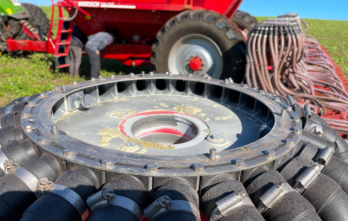 Distribution towers have dividers and smaller hoses that carry fertilizers to the seeding lines