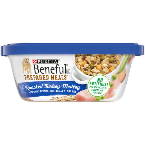 Calorie Content (calculated)(ME): 913 kcal/kg, 258 kcal/tub. Beneful Prepared Meals Roasted Turkey Medley’s formulated to meet the nutritional levels established by the AAFCO Dog Food Nutrient profiles for maintenance of adult dogs. With sweet potatoes, peas, barley & wild rice. Meaty chunks with a hearty sauce. 100% complete & balanced nutrition for adult dogs. No artificial preservatives, colors or flavors. Purina.com. how2recycle.info. Try Originals Dry Food. Prepared in our own US facilities. Printed in USA. Nourish your dog with a medley of wholesome ingredients with Purina Beneful Prepared Meals Roasted Turkey Medley wet dog food. Tender chunks with real turkey pack each bite with savory goodness, and the 23 essential vitamins and minerals in every serving help support your dog's active and playful lifestyle. Thoughtfully crafted with sweet potatoes, peas, barley and wild rice you can see, this high quality dog food provides 100 percent complete and balanced nutrition for your adult dog. Our high-protein recipe helps to support his strong muscles, so you can feel good about the food you serve while delivering on the scrumptious flavor he loves. The palate-pleasing texture and hearty sauce keep him coming back for more, and you can appreciate that this tasty recipe is made with no artificial colors, flavors or preservatives. A recloseable dog food tub makes it easy to store leftovers after each meal, so Purina Beneful wet dog food is always ready to offer to your four-legged friend. Serve this adult dog food as a meal, or pour our Prepared Meals over his favorite dry kibble to create delicious gravy dog food toppers for fun variety in his bowl. We proudly produce this Beneful wet dog food in Purina-owned, U.S. facilities.; Give your dog something to be thankful for every day of the year when you mix this Purina Beneful Prepared Meals Roasted Turkey Medley wet dog food with his favorite dry kibble.