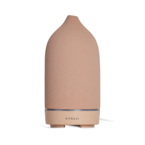 Scents your home naturally and looks beautiful while doing it. With a matte ceramic cover and sculptural silhouette, it doubles as a piece of decor.