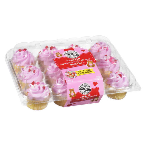 Vanilla Cupcakes topped with pink Vanilla Icing and Heart Shaped Toppers. Made in a Peanut Free Facility. May Contain Tree Nuts.