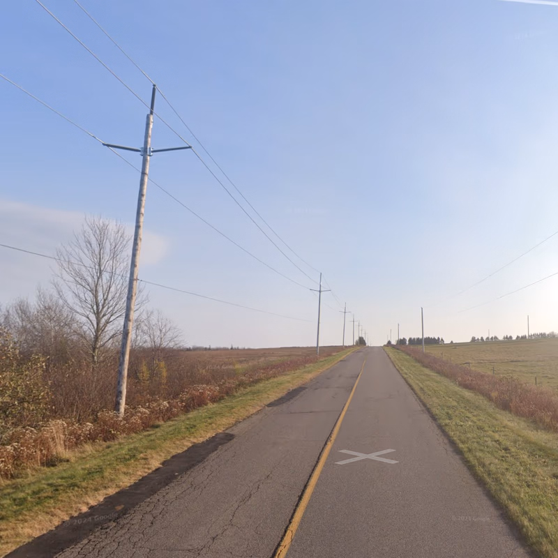 Prince Edward Island - Ribbed insulator poletops — how it looks in GeoGuessr