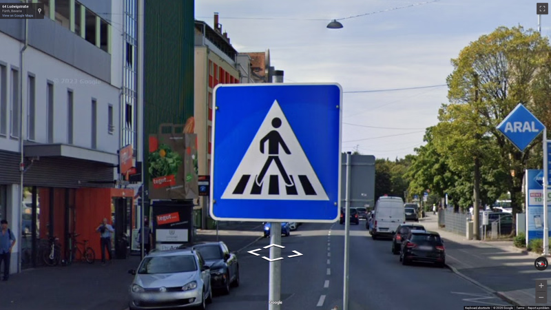 Pedestrian crossing sign — how it looks in GeoGuessr