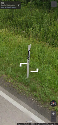 Latvia clue: Bollard with digit
