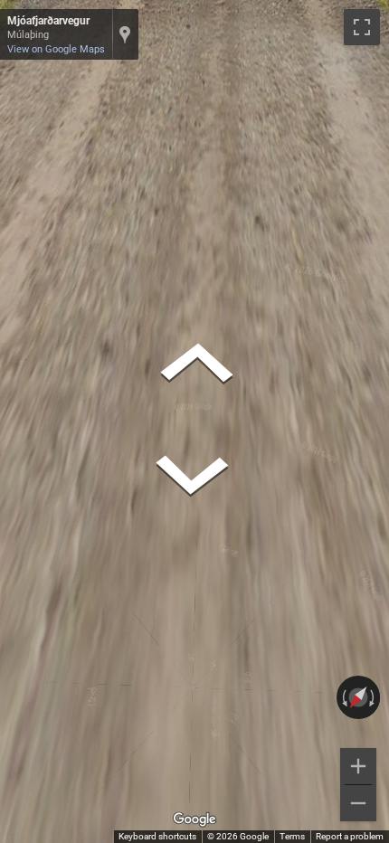 Icelandic white pickup truck with a Generation 4 camera, often appearing blurred, driving on a road.