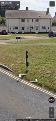 United Kingdom clue: Black-and-white striped bollard