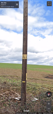 United Kingdom clue: Yellow warning sticker on the poles
