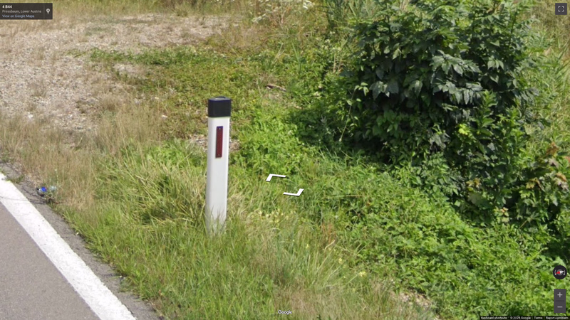 Bollard with black hat