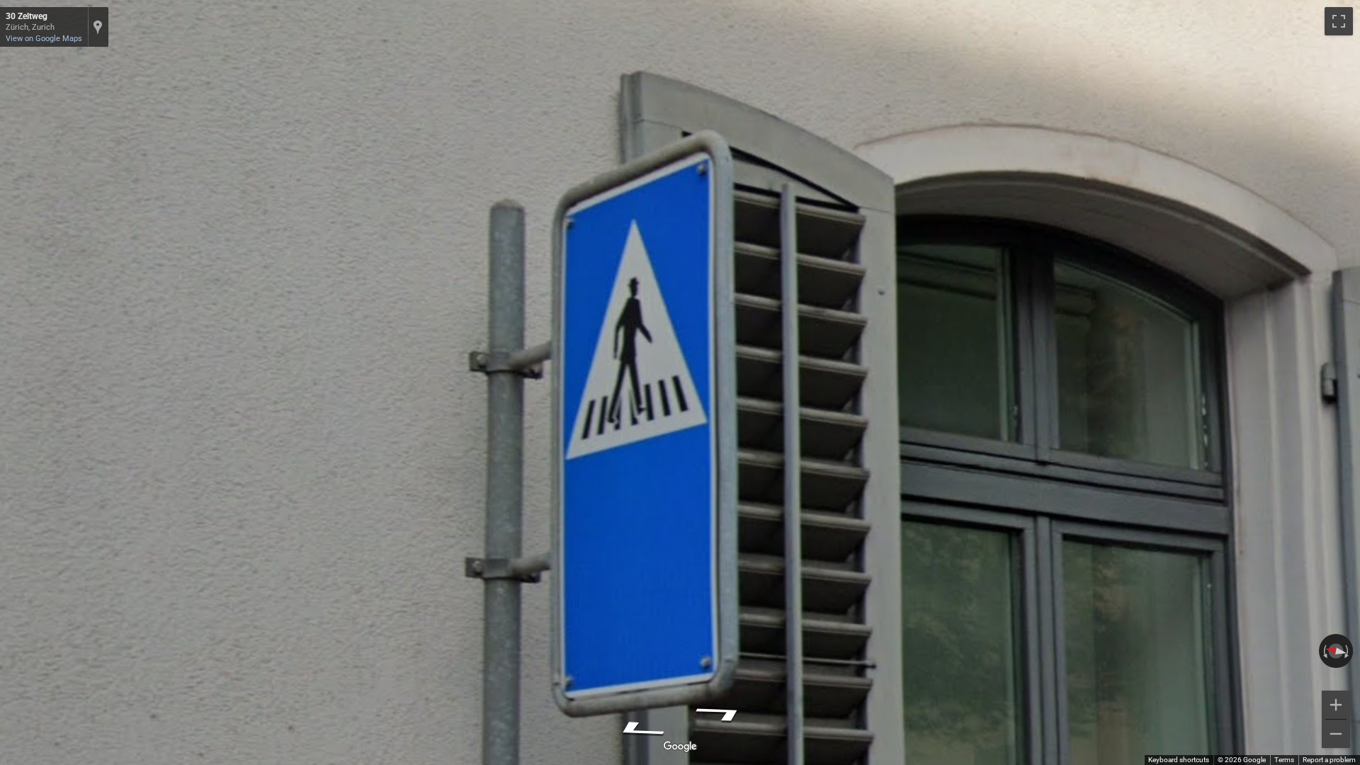 Pedestrian crossing sign with a hat