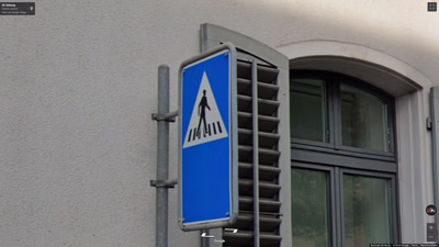 Switzerland clue: Pedestrian crossing sign with a hat