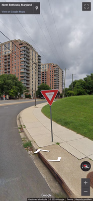 United States clue: Yield boards say “YIELD” inside an inverted triangle