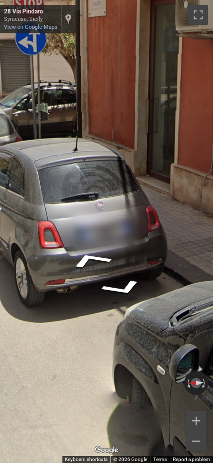 Italian rear license plate, long and rectangular, with blue vertical stripes on both the left and right edges.
