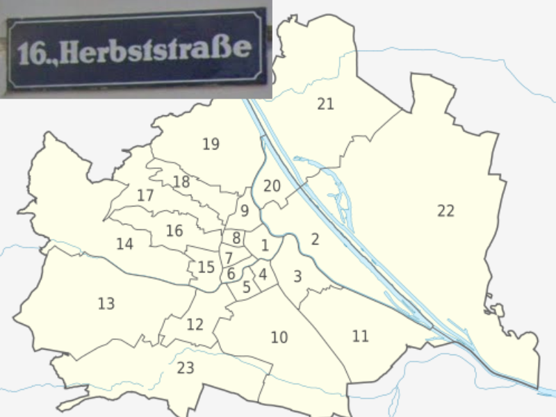 Austrian street sign in Vienna showing a dark blue background and a white district number before the street name.
