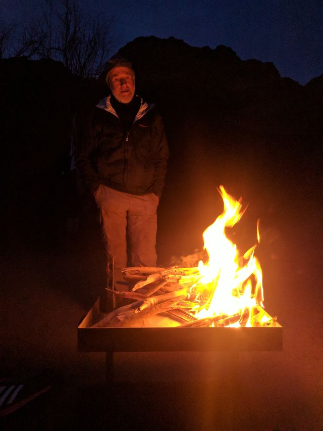 Ed talks in front of the fire