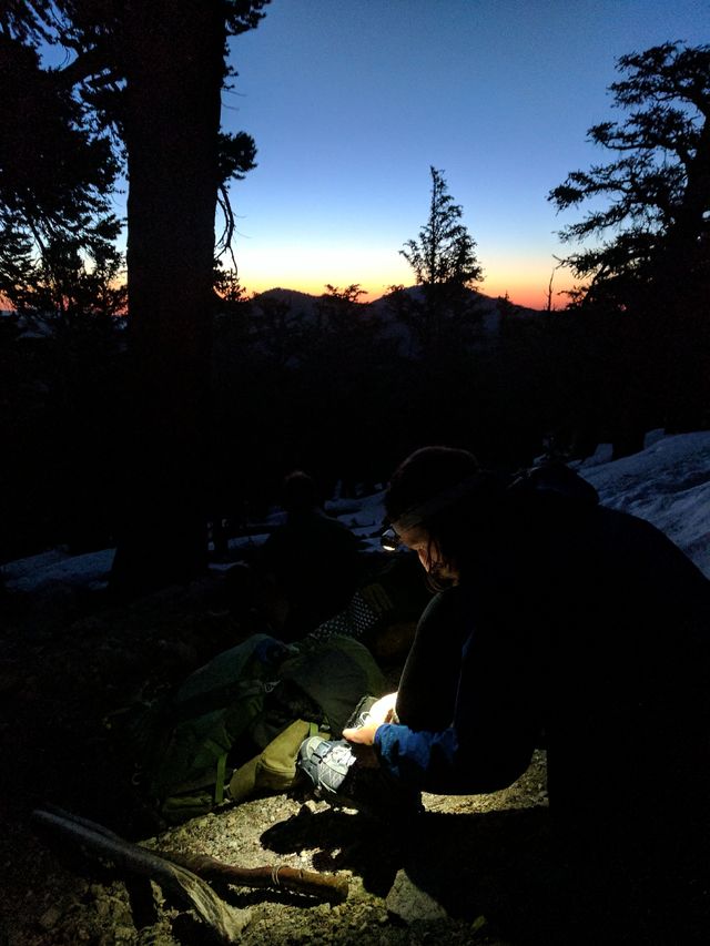 Monk spiking up in front of an impending sunrise