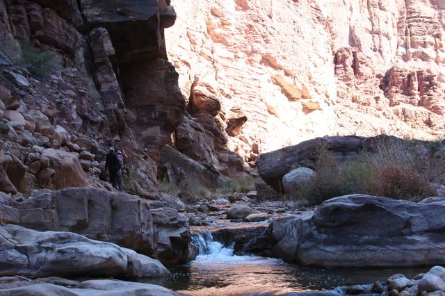 Amanda, Nick, and JB walk up a side canyon