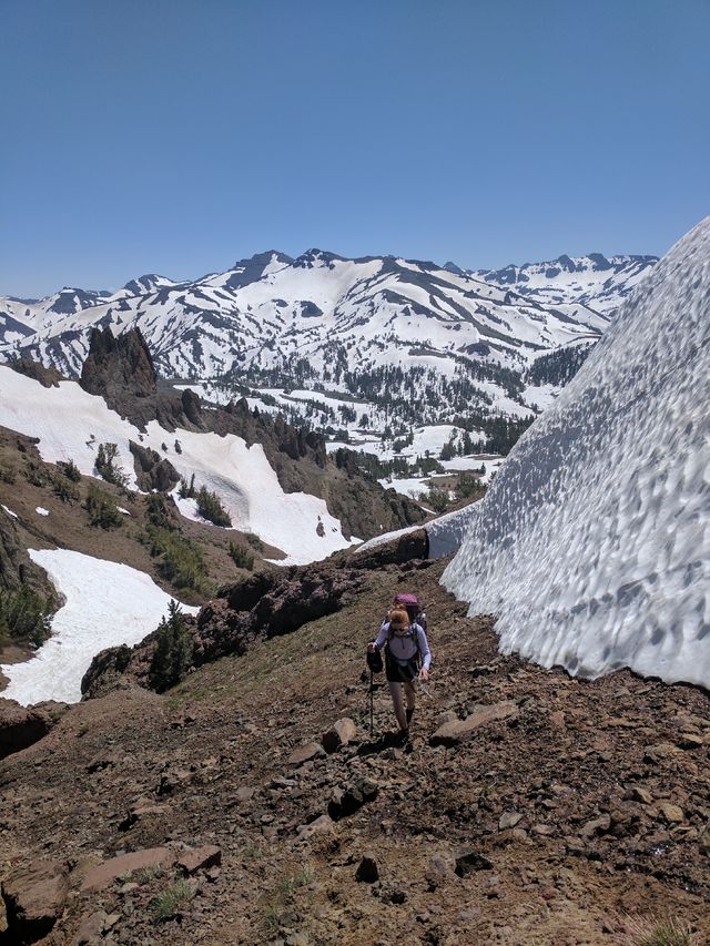 The trail is to her left, but buried under twenty feet of snow.